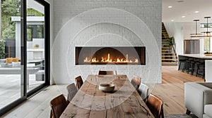 In the dining area a sleek white brick fireplace adds warmth and ambiance to the space while the minimalist design keeps