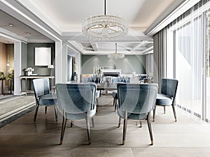 Dining in a modern living room with a trendy six-person dining table with blue upholstered chairs with a black granite server