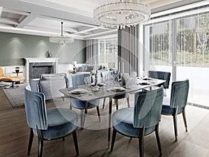 Dining in a modern living room with a trendy six-person dining table with blue upholstered chairs with a black granite server