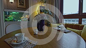 Dining room with aquarium. Creative. Unusual details of vintage expensive interior with aquarium. Bright aquarium in