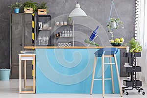 Dining room with blue kitchenette