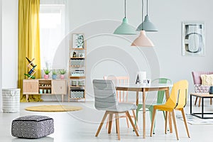 Dining room with colorful chairs