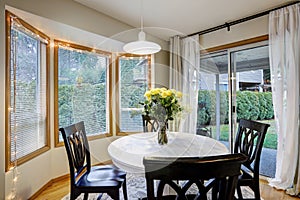 Dining room with curved window wall
