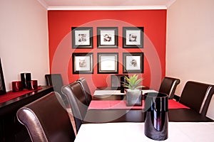 Dining room interior with red wall