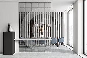 Dining room interior with table and chairs, black and white stripes wall, glass partition
