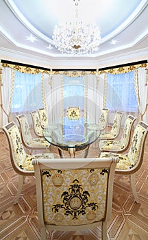 Dining room with luxury gilt furniture and beautiful table