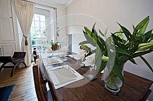 Dining room with massive wood furniture photo