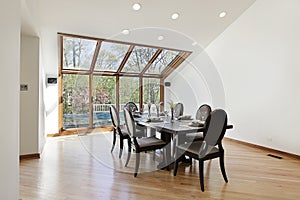 Dining room with wood trimed skylights