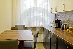 Dining table and appliances in the kitchen