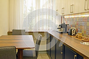 Dining table and appliances in the kitchen