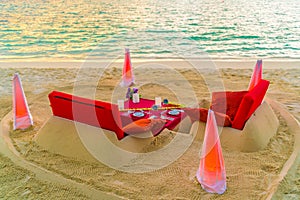 Dining table on beach at tropical Maldives island