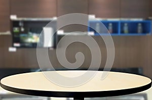 Dining table on blurred brown kitchen interior background
