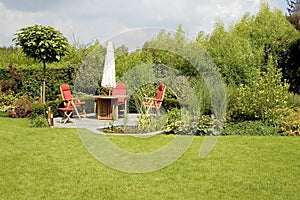 Dining table with chairs and parasol