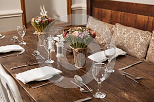 Dining table laid for dinner in pub, restaurant, hotel or home