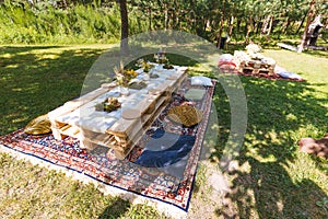 Dining table made of wooden pallets, outdoor, eating in nature