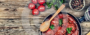 Dining table. Meatballs With parsley and cherry tomatoes. Rustic style.Wooden background, top view.