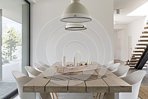 Dining table and white chairs photo