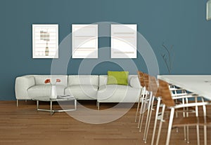 Dining table with with white sofa and pictures on the wall