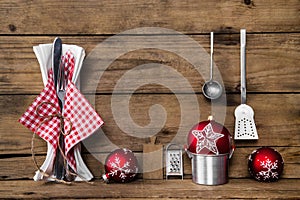 Dinner on christmas eve. Old wooden background with red white ch