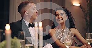 Dinner, date and couple with restaurant, love and happy from commitment at table. Smile, romance and luxury at