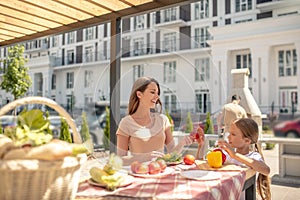 Daughter and mom getting ready for dinner
