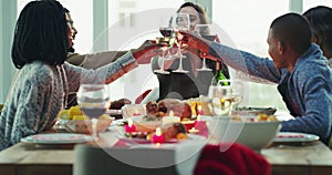 Dinner, friends and toast with wine in home for thanksgiving celebration. Cheers, champagne and group of people bonding