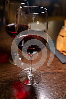 Dinner with glass of dry red wine in Italian osteria restaurant photo