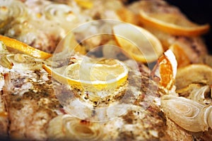 Dinner with marinated fish, onion and orange