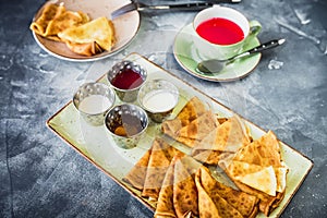 Dinner with pancakes, sour cream, honey, jam and cup of red tea