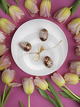 dinner plate with gold easter eggs, bow, tulips