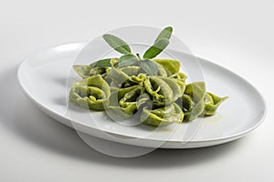 Dinner plate with green ravioli and sage