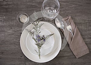 Dinner plate setting on wood table