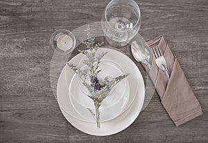 Dinner plate setting on wood table