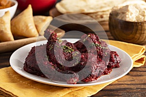 Dinner Set with Tandoori Chicken on a Wooden Table