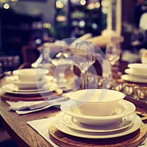 Dinner set up - Image. Table served for luxury dinner party with white plates, napkins, glasses, candles