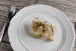 Dinner Setting with Gift. Suprize eating or gift dinner concept