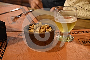 Beer and peanut table photo