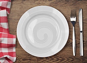 Dinner table with dinning plate, fork and knife photo