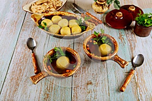 Dinner table with Jewish matzoh ball soup, matzo balls photo