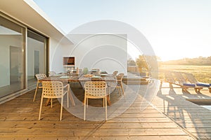 Dinner table setting in modern villa terrace