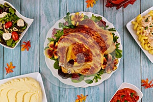 Dinner table for Thanksgiving Day. Turkey, chicken, garnish