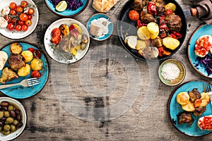 Dinner table with variety food, top view