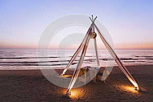 Dinner table for wedding couple on the beach in luxurious romantic hotel