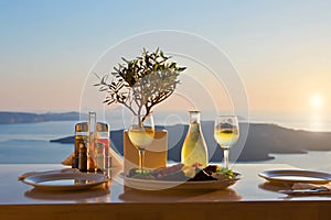 Dinner for two on a sunset background