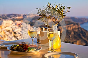 Dinner for two on a sunset background