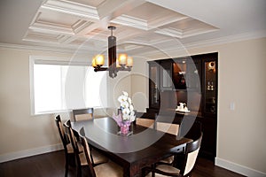 Dinning room with wood table and wood cabinets