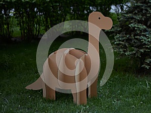 Dinosaur Brontosaurus made of cardboard. Idea for the birthday party, dino party or photo session