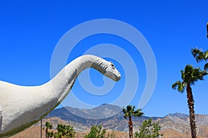 Dinosaur california blue sky palm trees