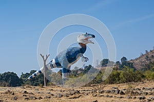 Dinosaur Tyrannosaurus effigy or Sculpture in the Forest photo