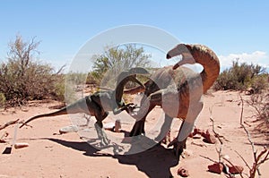 Dinosaur model in the sand